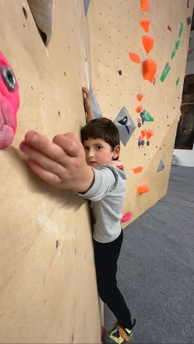 Young climbers filling in simple printed event scorecards