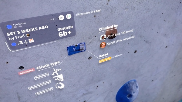 A smart tag on a climbing wall with information about the route overlaid on top