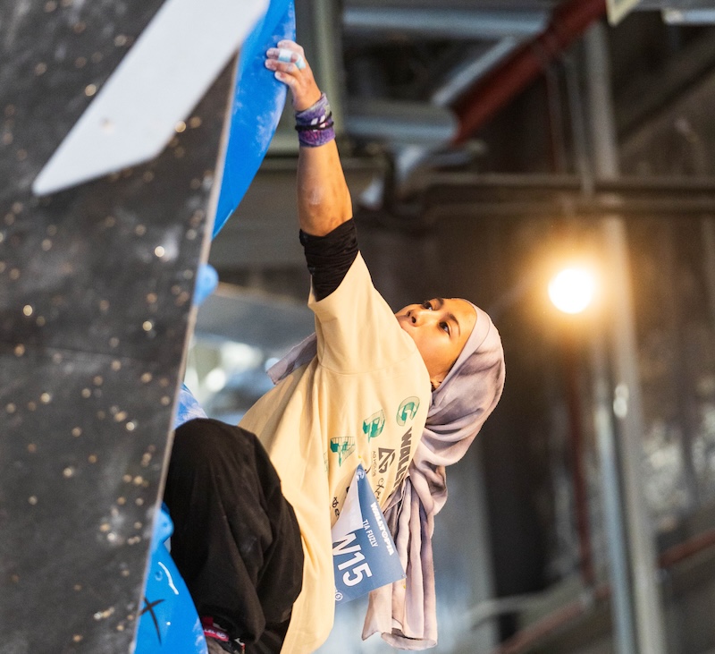 Climber competing at a bouldering event