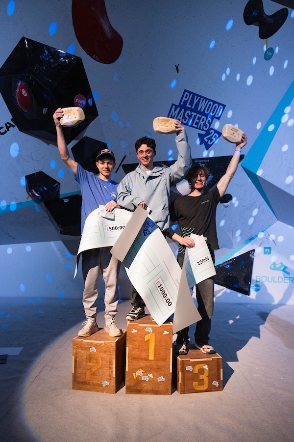 Climbers competing at a single-day bouldering event