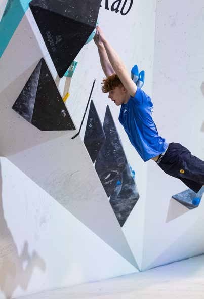 Climber competing on a bouldering wall