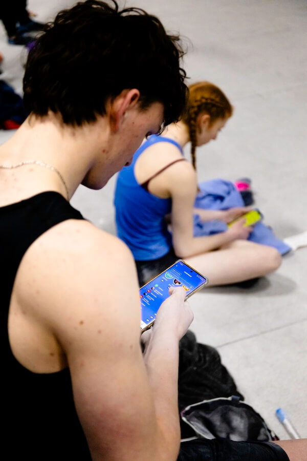 A climber on an indoor bouldering wall