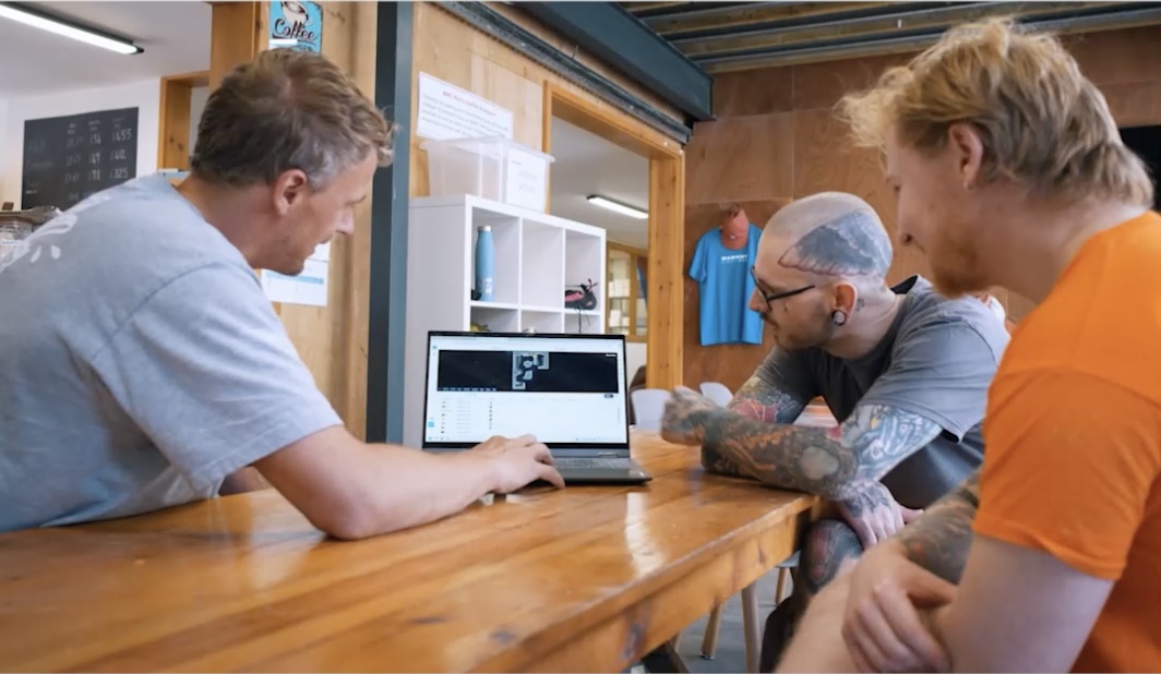 Setting team collaborating with a laptop