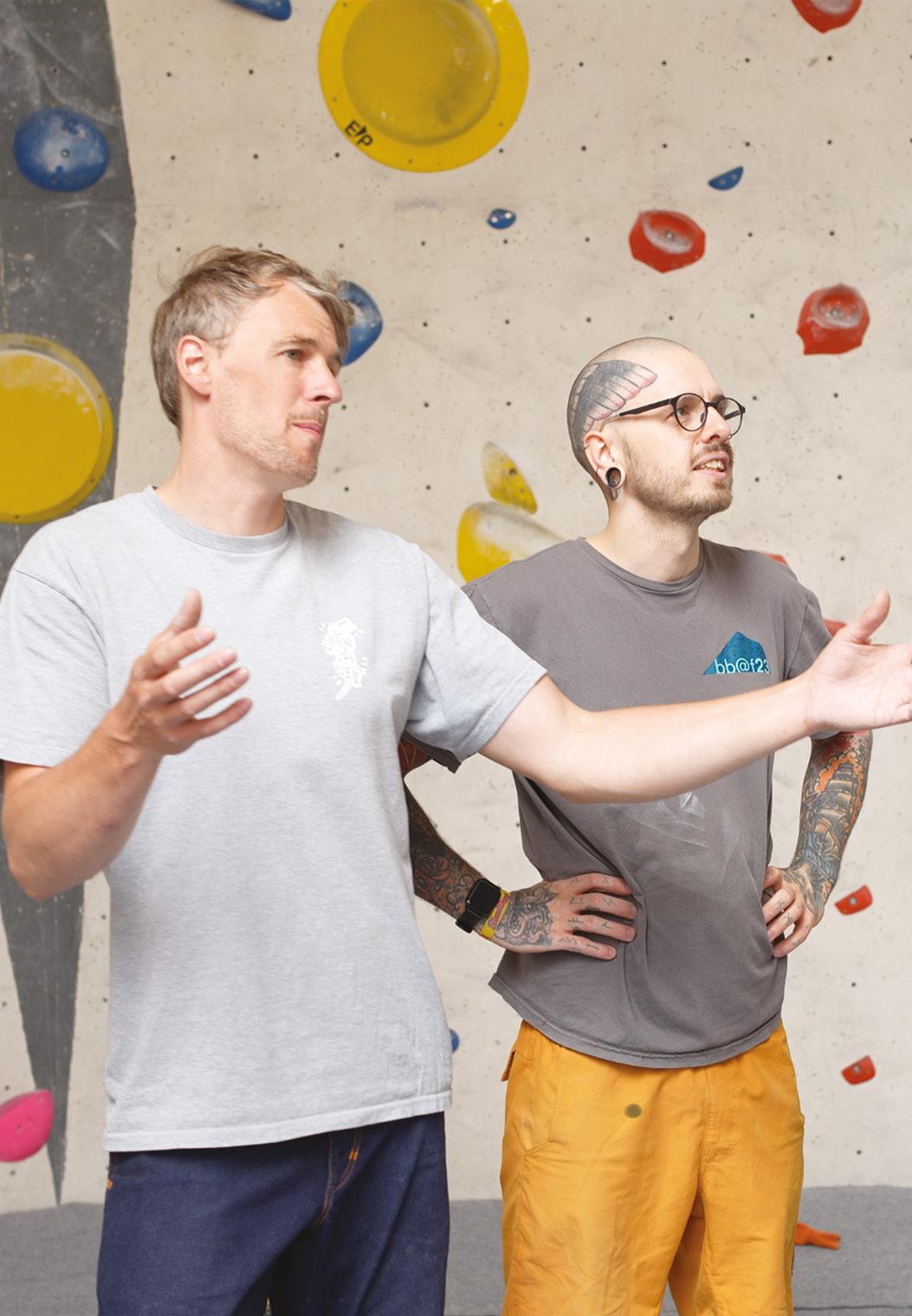 Two people discussing route colour-coded charts